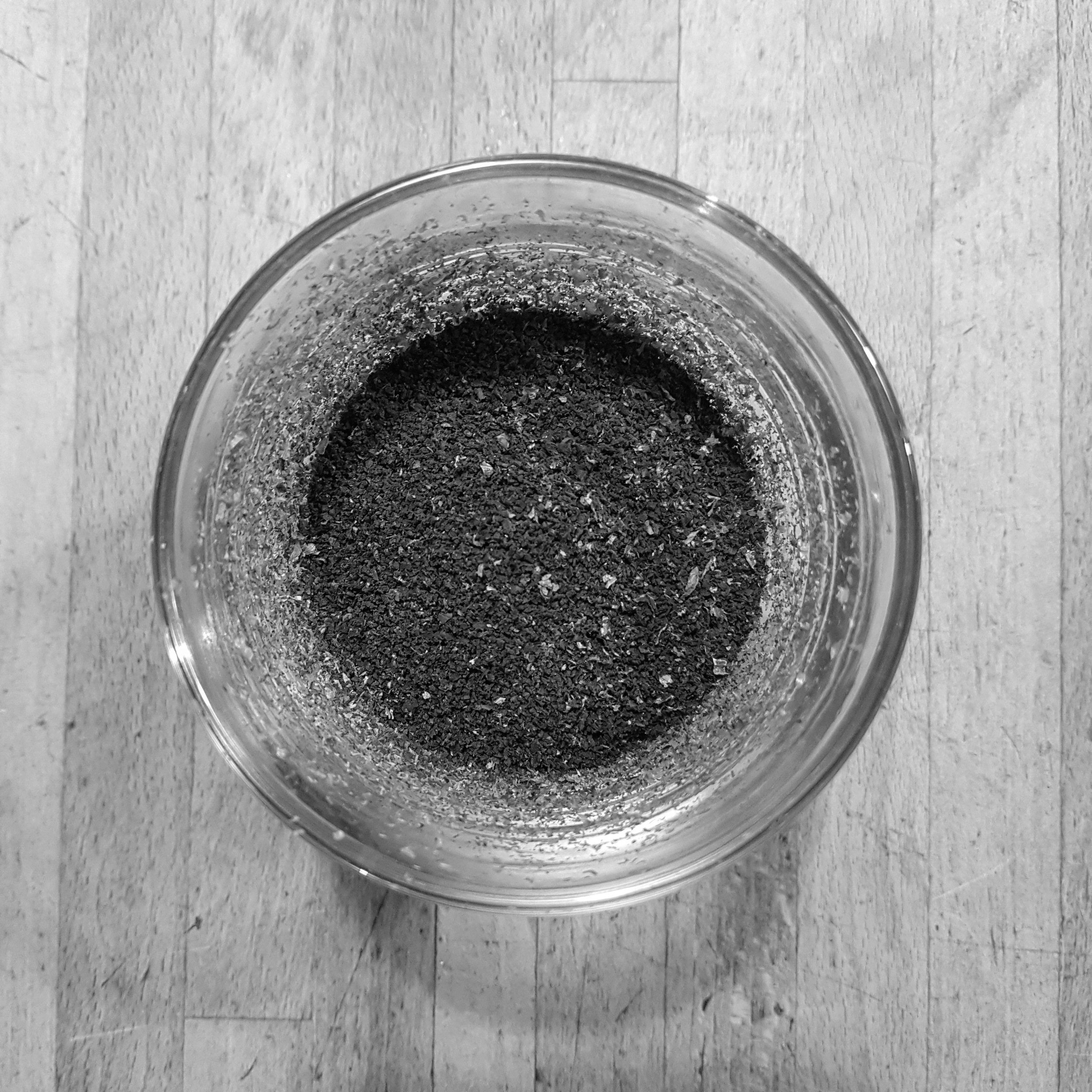 Coffee grounds in a glass, seen from above
