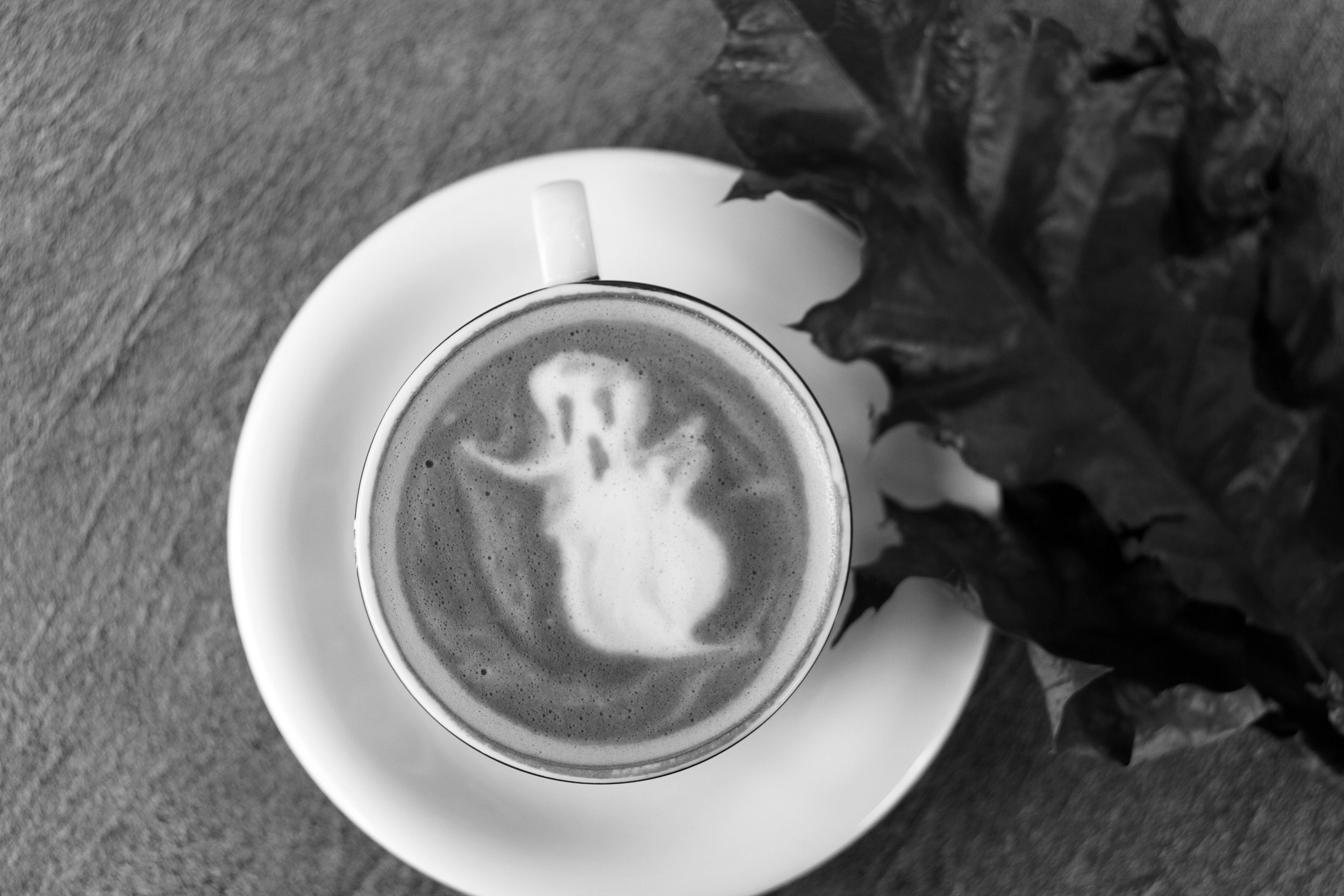 A ghost design in a latte, seen from above.