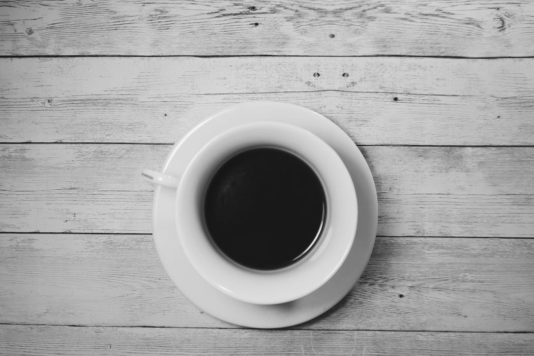 A cup of black coffee, seen from above