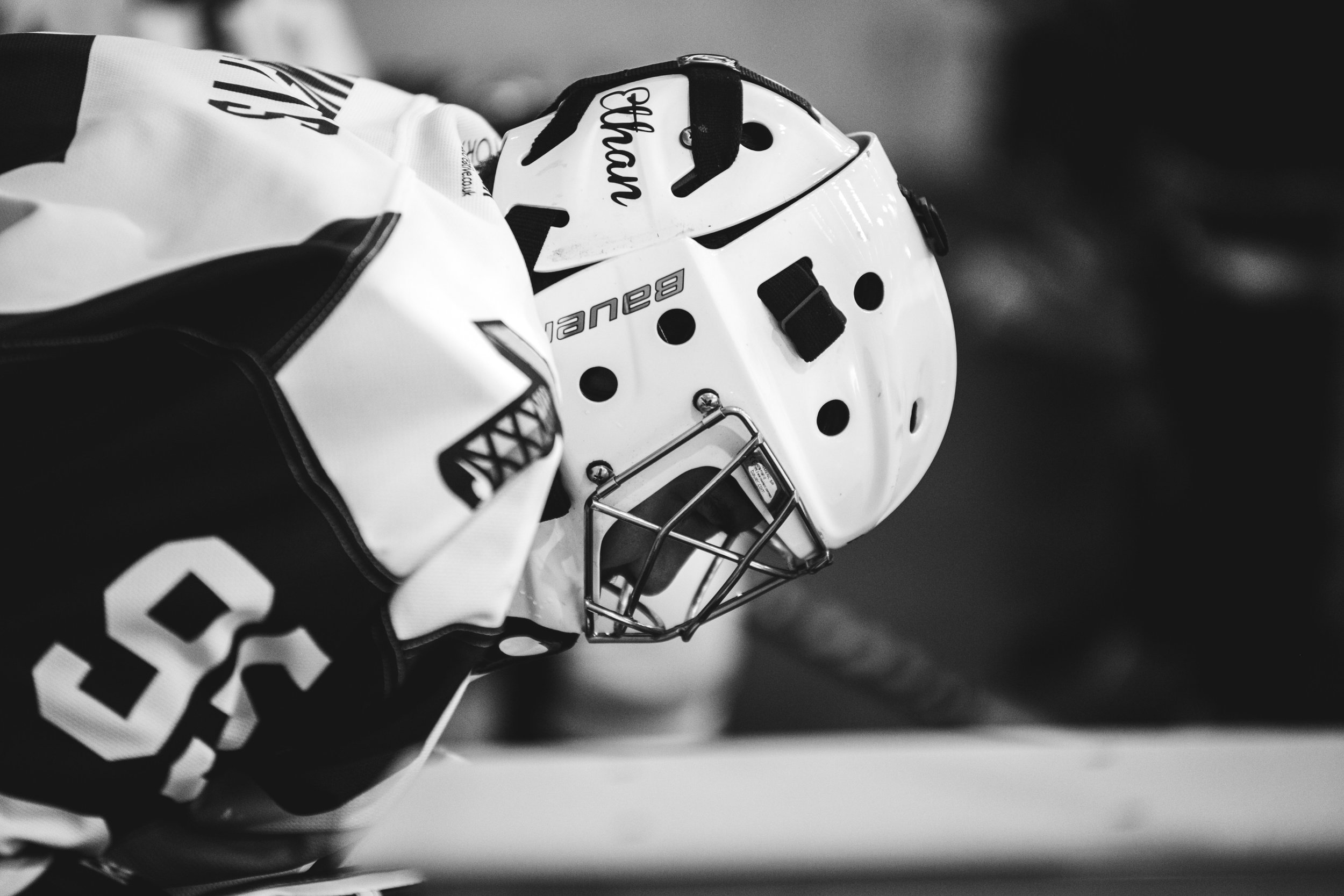 A hockey player wearing a helmet