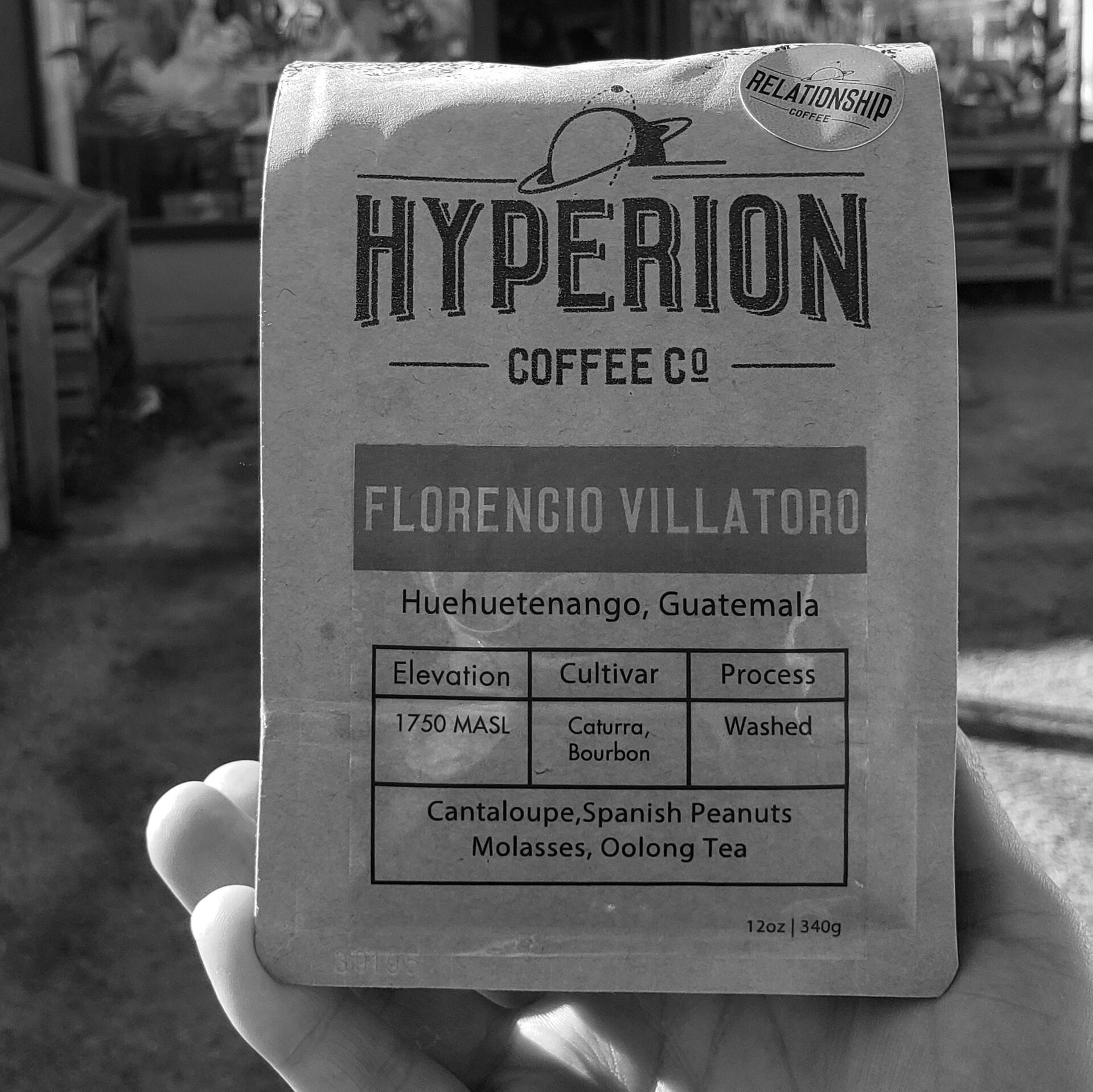 A bag of Hyperion Coffee Co. coffee, held up to the camera