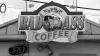 A Bad Ass Coffee shop sign featuring a cartoon donkey carrying coffee