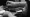 Closeup of the latex-gloved hands of an immigration officer stamping a passport