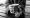 Close up of two hands holding a latte