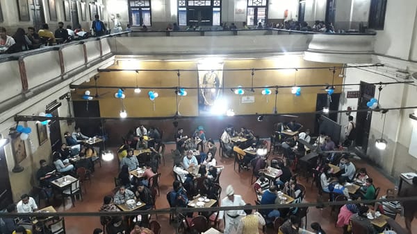 An interior of the Indian Coffee House in Kolkata taken from the balcony with tables full of people below